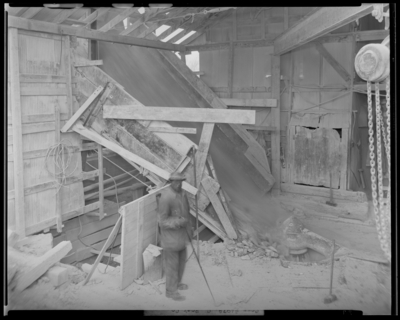 Central Rock Company, (Old Frankfort Pike); rock processing                             building; interior; worker operating equipment