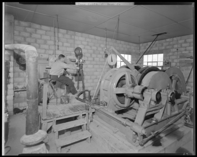 Central Rock Company, (Old Frankfort Pike); building; interior;                             worker operating a large electrically powered cable wench