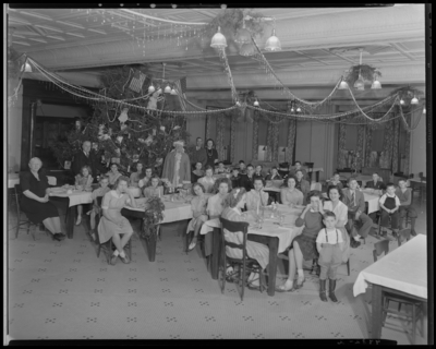 Odd Fellows Hall, 261 West Water; interior; Christmas Party with                             Santa; children gathered around banquet tables; Santa Claus standing                             next to Christmas Tree