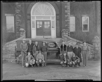 Sigma Gamma Epsilon group standing outside the Administration                             Building; Department of Geology automobile in background; (1943                             Kentuckian) (University of Kentucky)