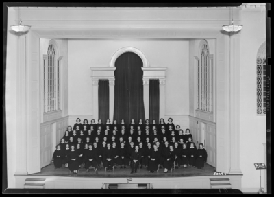Combined Glee Club standing on stage of Memorial Hall; University                             of Kentucky