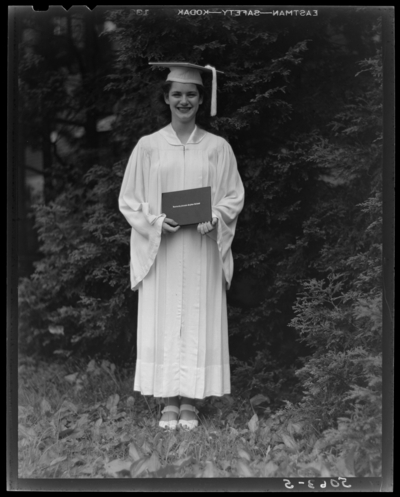 Kentucky Female Orphan School, 201-203 West Short; woman in cap                             and gown holding diploma