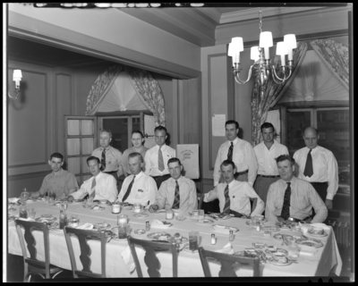 R.B. Robins; victory garden; group of men sitting around                             table