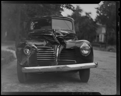 Lexington Yellow Cab Company, 150 North Limestone; wrecked car of                             C. C. Moore