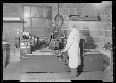 United Service Company, 176 East High; interior; man with                             machine