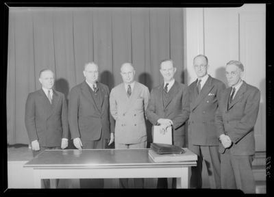 Kentucky Utilities Company (167 West Main Street); group of men                             standing around table