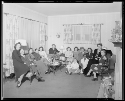 Mrs. W.T. Scully; Christmas party; group gather in                             room