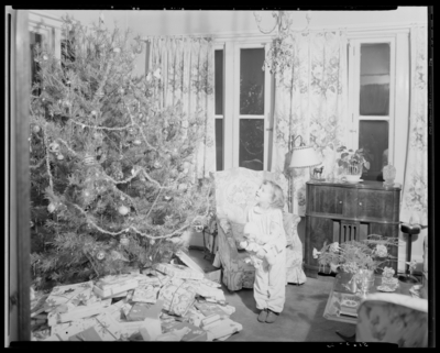 Mrs. W.T. Scully; Christmas party; girl sitting next to Christmas                             tree