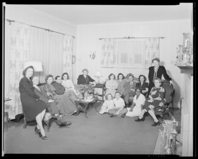 Mrs. W.T. Scully; Christmas party; group gather in                             room