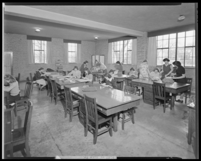 Garth High School; interior of home economics class; students                             working at desk