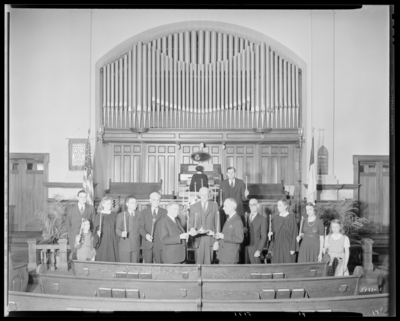Park Methodist Church, 645 East High; interior; group standing at                             alter