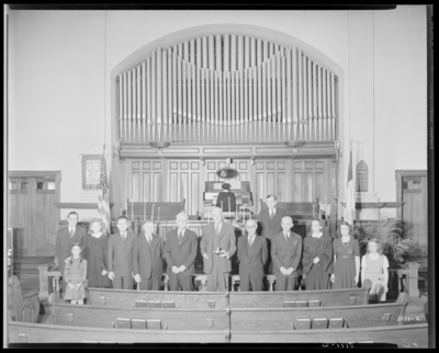 Park Methodist Church, 645 East High; interior; group standing at                             alter