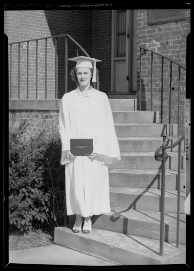 Kentucky Female Orphan School, 201-203 West Short; individual                             standing with diploma; Baunstark