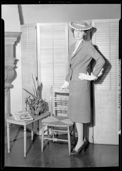 Loom & Needle, 170 Esplanade (clothing); woman standing                             wearing a hat