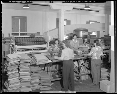 National Distillers Corporation; packing department, women                             working on assembly line