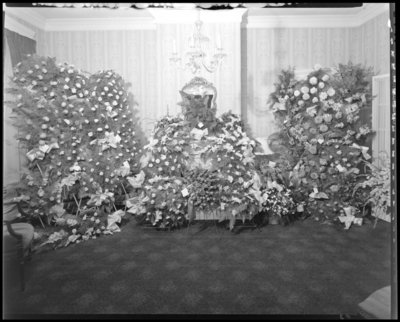 Ernest A. Welch III & Lawrence Conrad; corpses of two                             boys; open casket surrounded by flowers