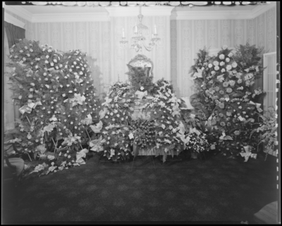Ernest A. Welch III & Lawrence Conrad; corpses of two                             boys; open casket surrounded by flowers