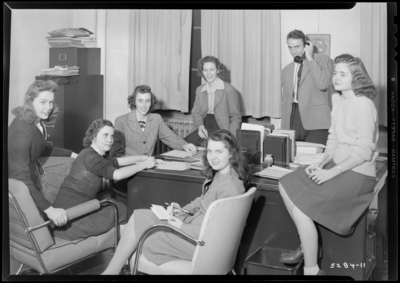 Features, (Kentuckian) (University of Kentucky); Student Union                             Building; interior; group of women gathered around a desk