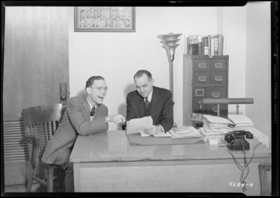 Features, (Kentuckian) (University of Kentucky); Student Union                             Building; office interior; Mr. Peak & Norman Chrisman seated at                             a desk
