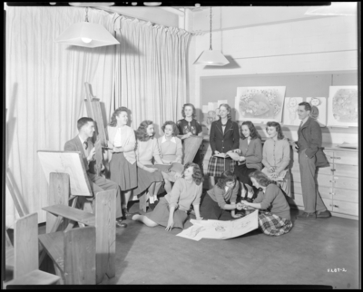 Art Club, University of Kentucky; Biological Building; interior;                             students gathered around easel