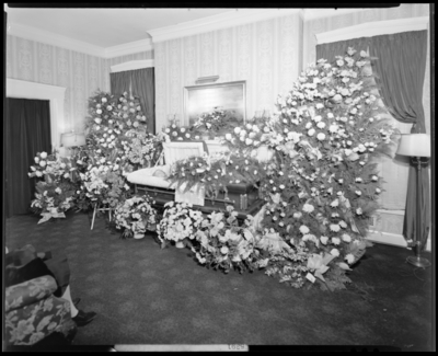 Miss Nittie Catherine Wiedmer; corpse; open casket surrounded by                             flowers