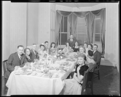 Dinner Party; Phoenix Hotel, 120-122 East Main; interior; Mr.                             Long and guests gathered around banquet table