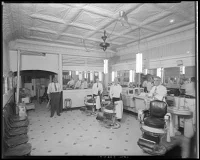 O.K. Barber Shop, 118 South Upper; interior; barbers standing                             next to their chairs
