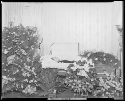 John W. Murphy; corpse; open casket surrounded by                             flowers