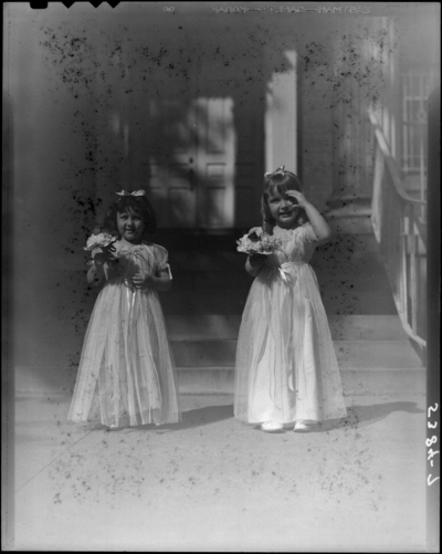 St. Joseph's Hospital, 544 West Second (2nd) Street; Cadet                             Nurses (graduation); exterior; two young girls holding                             flowers