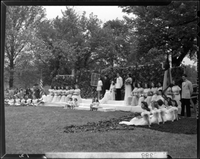 Georgetown College; May Day Celebration; outdoors; Queen sitting                             on stage with her court