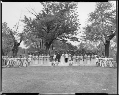 Georgetown College; May Day Celebration; outdoors; Queen sitting                             on stage with her court
