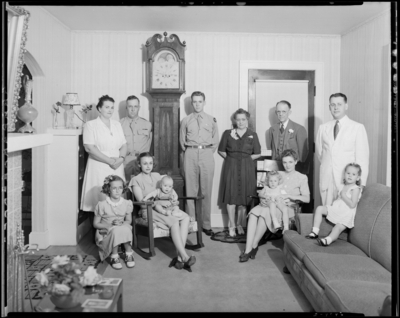 J. R. Nunnely; (107 Suburban Court); interior; family members                             standing and sitting next to grandfather clock
