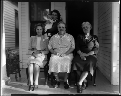 Mrs. Frank Daugherty; four generations; group of women sitting on                             porch