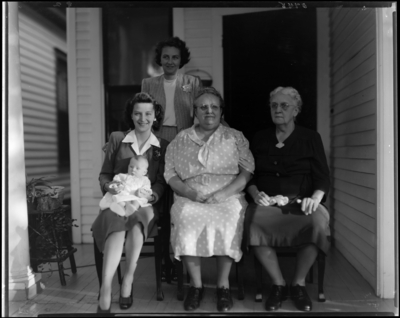 Mrs. Frank Daugherty; four generations; group of women sitting on                             porch