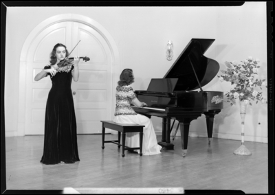 Cardome Academy; bookshelf; women playing piano and                             violin