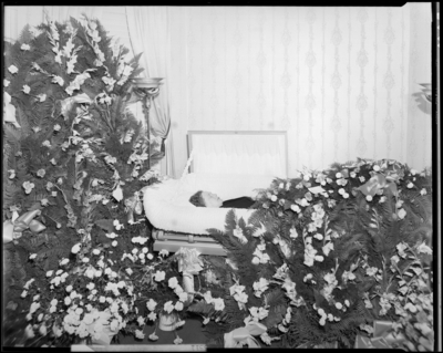Mrs. Cersee Jones; corpse; open casket surrounded by                             flowers