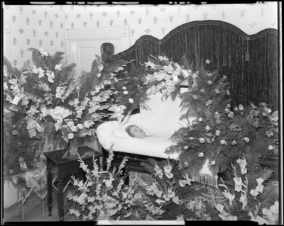 Miss Ella Ford; corpse; open casket surrounded by                             flowers