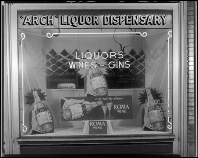 Arch Liquor Dispensary, 228 East Main; exterior; window display                             for Roma wine