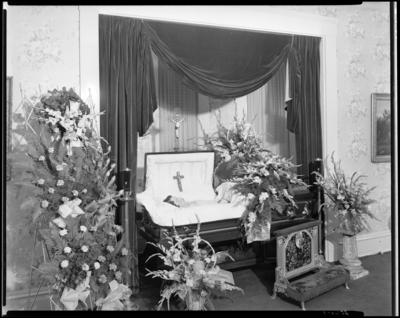 Josephine Erwin; corpse; open casket surrounded by                             flowers