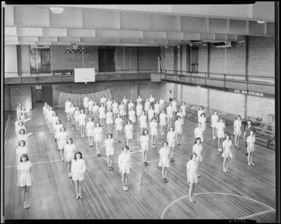 Garth High School; girls gym class; gymnasium (gym); interior;                             group in formation for activities