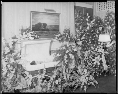 Mrs. Arby Glass; corpse; open casket surrounded by                             flowers