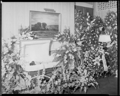 Mrs. Arby Glass; corpse; open casket surrounded by                             flowers