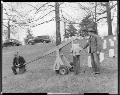 Tombstone puller; Lexington Cemetery; two men operating tombstone                             puller