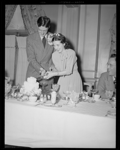 Mr. & Mrs. Pat Mullendore (Mullendare); wedding;                             reception; interior; wedding couple (bride and groom) cutting wedding                             cake