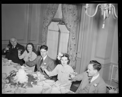 Mr. & Mrs. Pat Mullendore (Mullendare); wedding;                             reception; interior; wedding couple and guests gathered around banquet                             table