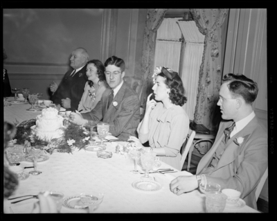 Mr. & Mrs. Pat Mullendore (Mullendare); wedding;                             reception; interior; wedding couple (bride and groom) and guests                             gathered around banquet table