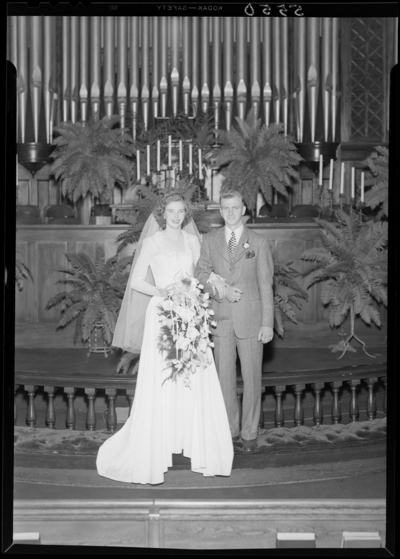 Mr. & Mrs. Richard Wall; wedding; interior; bride and                             groom standing in front of pipe organ