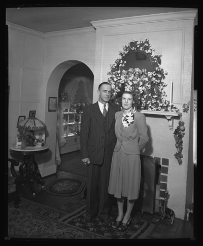 Mr. & Mrs. Thomas R. Putman; 208 Rose; wedding; interior;                             bride and groom standing in front of fireplace