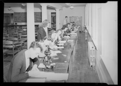 Georgetown College; science laboratory; interior; students using                             microscopes