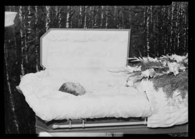 Mrs. Emma Dell Dudley (African American); corpse; open casket                             surrounded by flowers